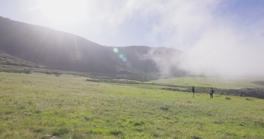 A group of young adult men explore California coastal fields. Shot on Canon R5