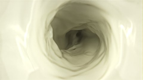 A whirlpool of milk. Top view. The texture of milk. Filmed on a high-speed camera at 1000 fps. High quality FullHD footage