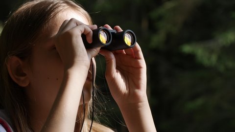 Child Using Binoculars in Mountains Forest, Tourist Kid Hiking at Camping, Wood Alpine Trails, Girl Traveling in Trip, Excursion
