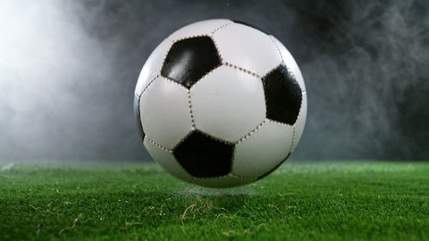 Close-up of Falling Soccer Ball on Football Field, Super Slow Motion at 1000 fps. Filmed on High Speed Cinematic Camera at 1000 fps.