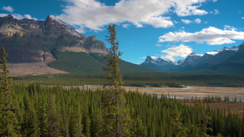 Pan right of Howse Pass Viewpoint in Banff National Park, Canada. This famous viewpoint offers views of Howse River and Pass, North Saskatchewan River, and Mt. Sarbach. 4K UHD video. Royalty-Free Stock Footage #1088851445