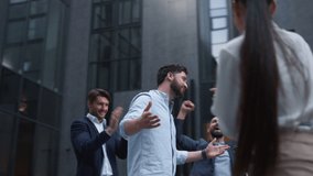 Joyful boss share news on successful contract outdoors. Work team appreciation. Cheerful diverse employees applauding celebrating victory together. Happy attractive manager read throw up deal papers. - Powered by Shutterstock - Get 15% off with code: PIKWIZARD15