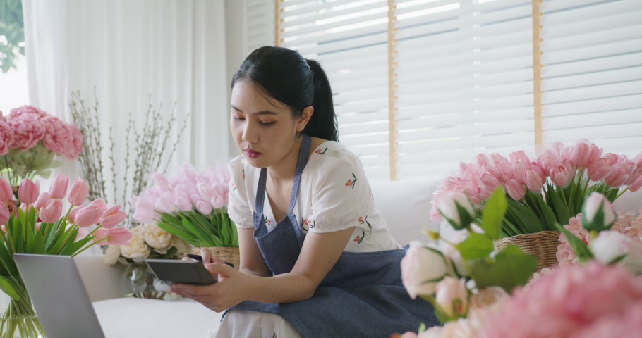 Asia people young woman thoughtful looking away doubtful stress worry in bad news financial economy recession cash flow crisis in small SME issue impact from covid coronavirus at home office store. Royalty-Free Stock Footage #1088857765