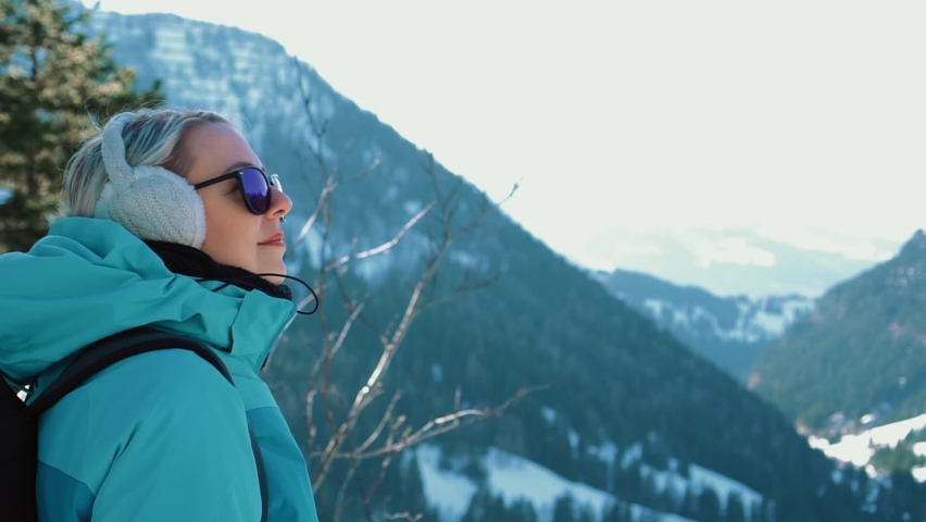 Close up woman enjoy mountain site wood nature alps sunny winter view | Shutterstock HD Video #1088862791