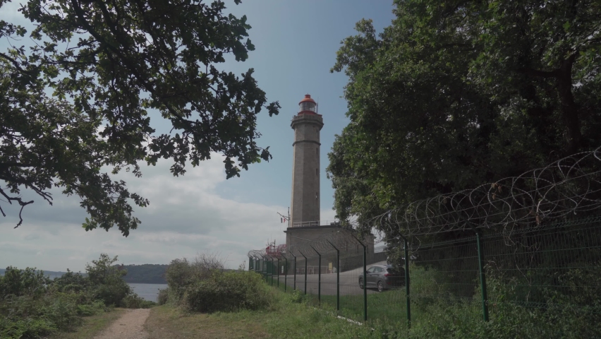 Phare Du Portzic lighthouse and the rocky shore of the ocean in the French city of Brest. View of the Phare du petit minou in Plouzane, Brittany, France. Portic Lighthouse. 