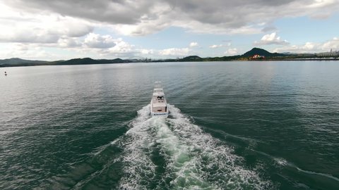 4K Aerial view boat sailing in the bay. Sport fishing, sea, ocean, blue, green, mountains