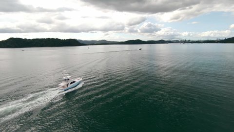 4K Aerial view boat sailing in the bay. Sport fishing, sea, ocean, blue, green, mountains