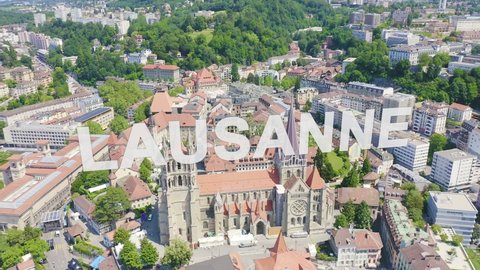 Inscription on video. Lausanne, Switzerland. Cathedral of Lausanne. La Cite is a district historical centre. Glitch effect text, Aerial View, Point of interest