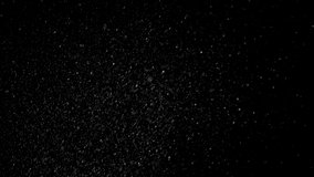 Dust, particles on black screen. Alpha channel video of snowflakes,  falling particles, snow rain, glitter. 