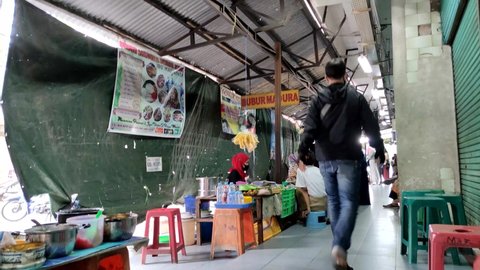 Surabaya, Surabaya, Indonesia - March 3 2022 : Old Atom Market alleyway. There are many food stalls here