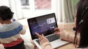 Trader mother studying blockchain market on streaming lesson with her child at home - Trading and new financial technology