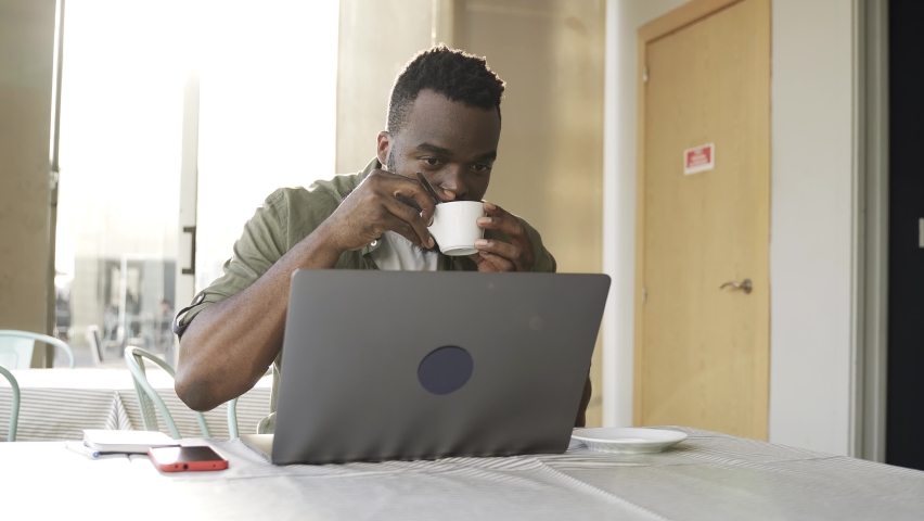 Business african man working with computer laptop at bar restaurant - Powered by Shutterstock - Get 15% off with code: PIKWIZARD15