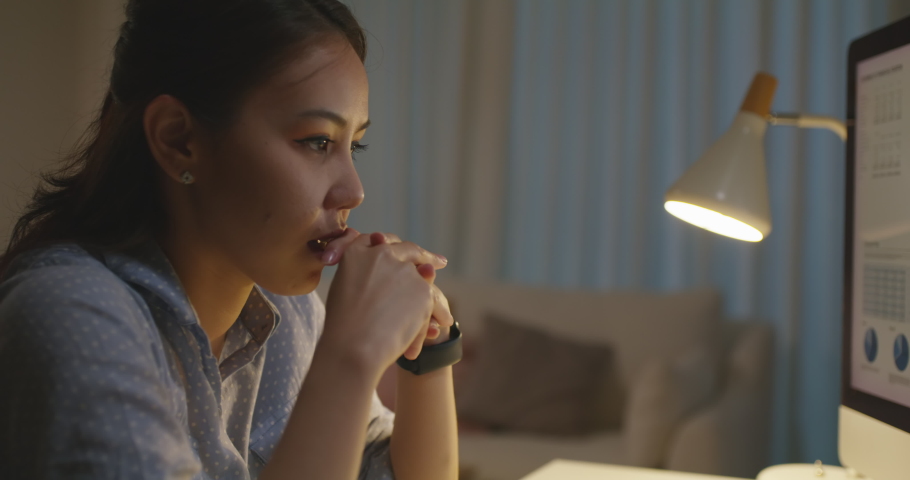 Asia people young woman study hard overnight brownout bored remote learn online read data tired sitting head in hands at home office desk workplace think worry in job tough stress workforce issue. Royalty-Free Stock Footage #1088879347