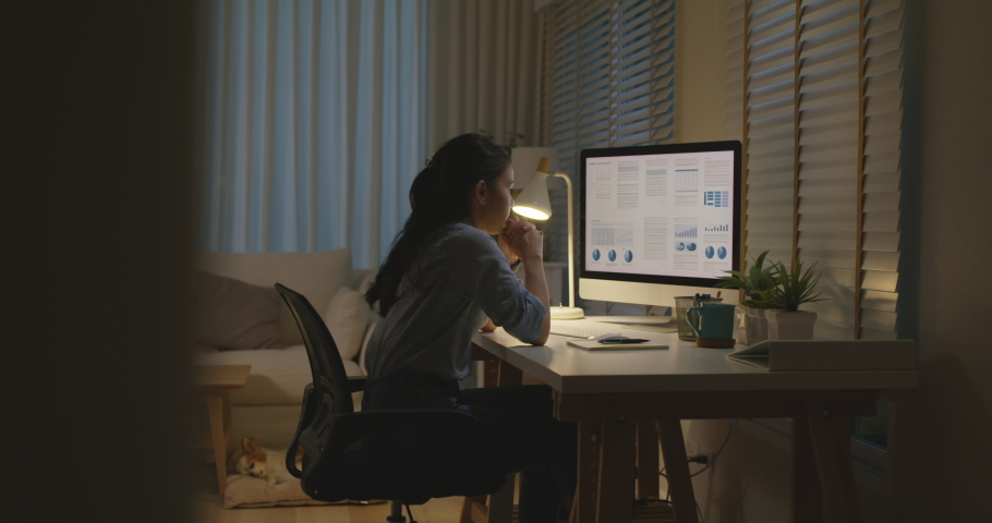 Asia people young woman study hard overnight brownout bored remote learn online read data tired sitting head in hands at home office desk workplace think worry in job tough stress workforce issue. | Shutterstock HD Video #1088879349
