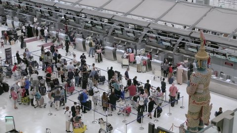 March 23,2022 : Bangkok, Thailand : POV inside the airport departure terminal  Suvannabhumi Airport with many passenger while covid outbreak