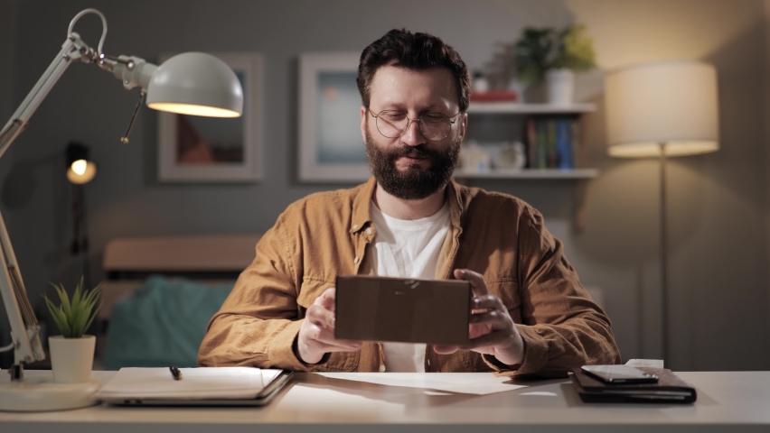 Man opens box of negative emotions. Bearded male buyer unpacking defective purchase. Frustrated buyer of online store with home delivery Royalty-Free Stock Footage #1088885983