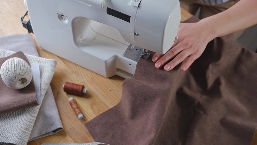 Sewing. Recycling Made by hand from home.sewing machine and the project quarantine, lockdown.Hobby,meditation,zero waste,recycling.Girl sews clothes home on sewing machine, ecology,sewing backround | Shutterstock HD Video #1088887501