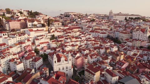 Aerial panoramic view of downtown of Lisbon, Portugal. Drone footage of the Lisbon old town skyline. Historical district Alfama at sunrise in capital city of Portugal