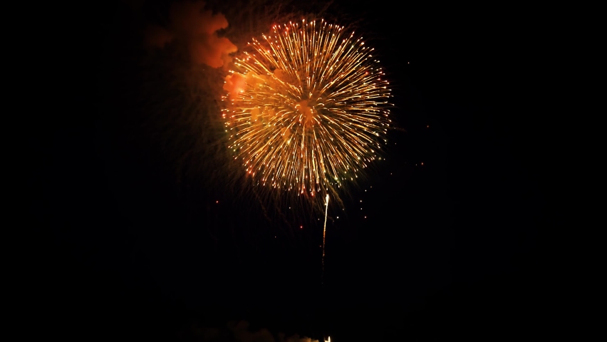 4K. loop seamless of real fireworks background. abstract blur of real golden shining fireworks with bokeh lights in the night sky. glowing fireworks show. New year's eve fireworks celebration | Shutterstock HD Video #1088891781