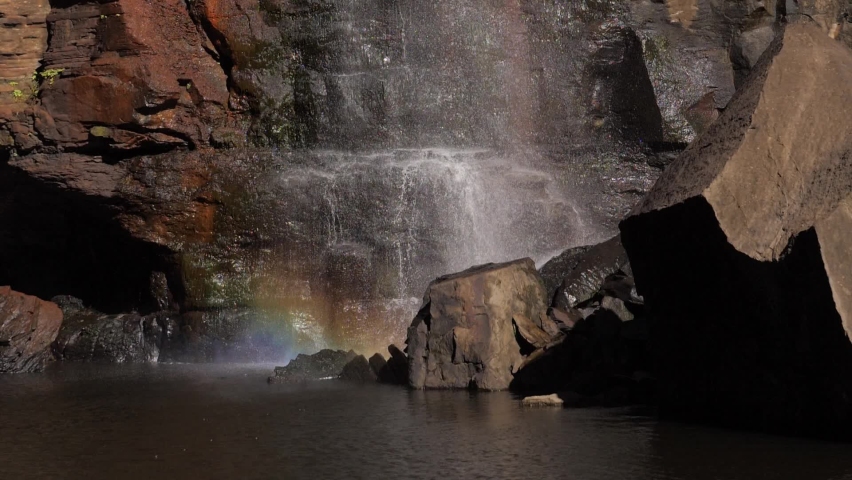 Waterfall Rainbow on a Rocky Backdrop Royalty-Free Stock Footage #1088894485