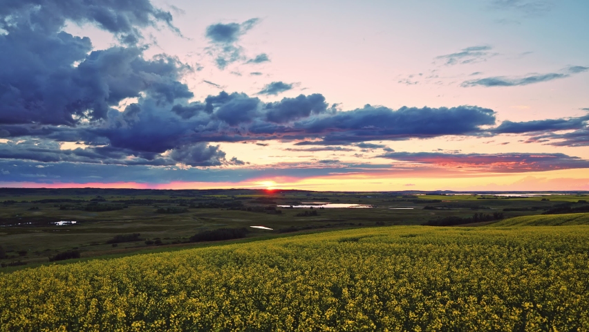 Sunset timelapse over the farmer’s pasture in Alberta’s Prairies, Canada. Blue sky with moving clouds. Canadian Prairies. Western Canada | Shutterstock HD Video #1088895321