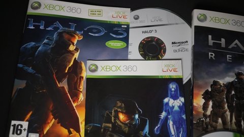 Rome, Italy - March 26, 2022, detail of the covers and DVDs of the game Halo 3 and Halo Reach for Xbox 360.