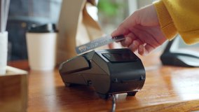 Customer using credit card for payment to owner at cafe restaurant, cashless technology and credit card payment concept - Powered by Shutterstock - Get 15% off with code: PIKWIZARD15