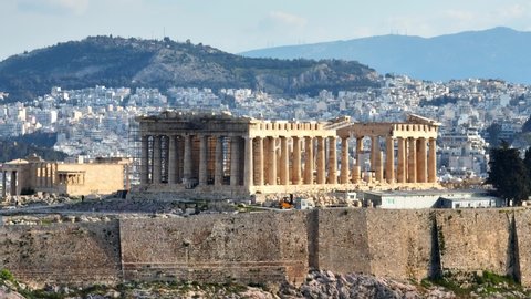 aerial tele shot of Acropolis in Greece, Parthenon in Athens, flying around famous Greek tourist attraction, Ancient Greece landmark. High quality 4k footage
