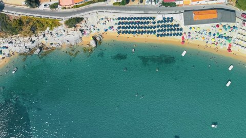 Amazing overhead aerial view of Cavoli Beach, Elba Island in summer season, Italy. Slow motion