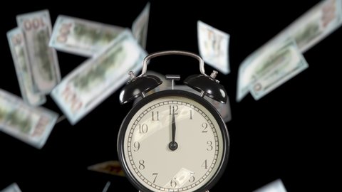 Time to Make a Great Money. The hands of the clock rotate rapidly on the dial. Exactly at 12 o'clock the alarm clock starts ringing. Against a black background, banknotes begin to slowly fall down