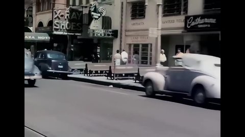 CIRCA 1940s - Street scenes show a busy Florida thoroughfare.
