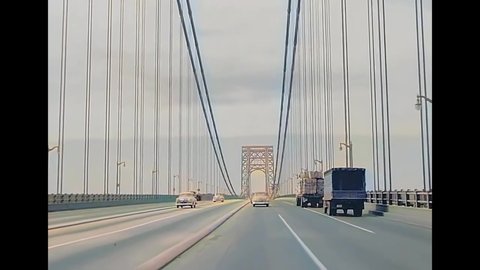 CIRCA 1940s - Excellent footage shot from the front of a car as it drives over the George Washington Bridge.