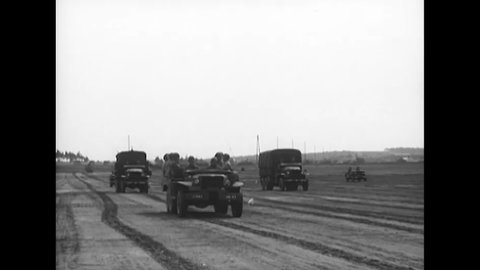 CIRCA 1949 - Tanks, jeeps, trucks, and L-5 planes are included in an Army Day parade put on by the 6th Armored Cavalry stationed in Germany.