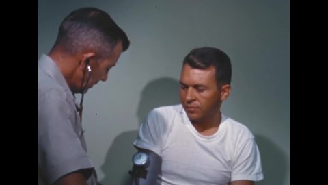 CIRCA 1960s - Astronaut Elliott See gets his blood pressure checked.