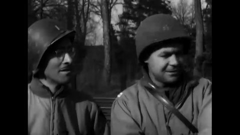 CIRCA 1945 - American soldiers pose in the turret of their M-10 tank before driving away.