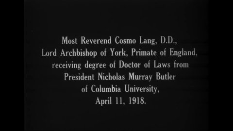 CIRCA 1918 - Columbia University's President Butler presents an honorary degree to Archbishop Cosmo Lang of York.