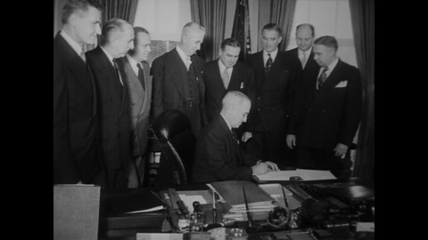 CIRCA 1951 - President Truman signs the Federal Civil Defense Act into law.