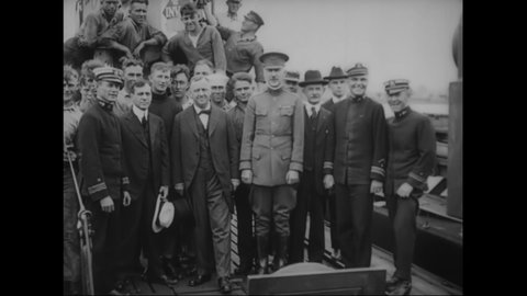 CIRCA 1918 - US Naval and Army officers pose with civilian men on top of a docked ship.