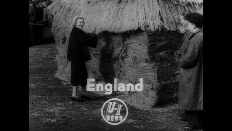 CIRCA 1952 - A woman wins a new sewing machine by finding a needle in a haystack.