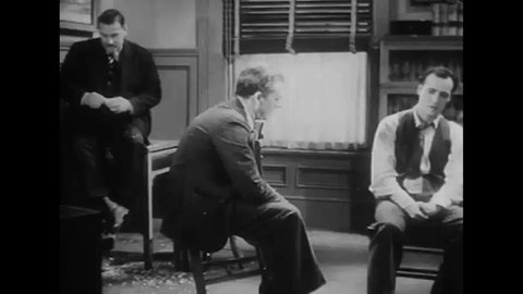 CIRCA 1931 - In this mystery movie, a detective interrogates a murder suspect.