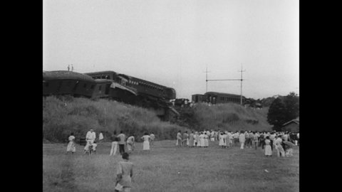 CIRCA 1952 - People come up for a closer look at the wreckage caused by two trains crashing into each other in Rio de Janeiro, Brazil.