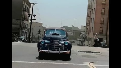 CIRCA 1940s - A camera fixed on a car travels uphill and downhill in San Francisco, California.