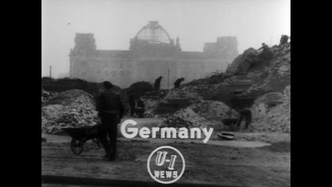 CIRCA 1952 - Workmen in Berlin find secret tunnels under the Reichstag, which were used by Nazi officials to reach underground air raid shelters.