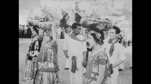CIRCA 1933 - Indigenous people of Oaxaca, Mexico present gifts and perform traditional dances for President Rodriguez.