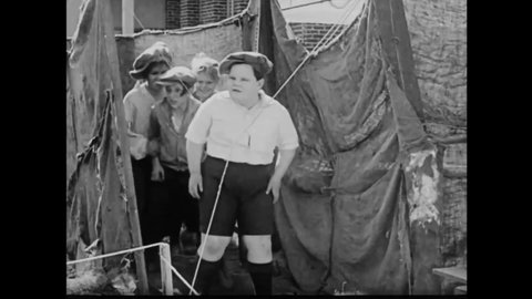 CIRCA 1924 - In this comedy movie, boys are afraid to take on the bullies who've crashed their wild west show but a little girl vows to take him on.