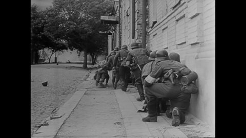 CIRCA 1941 - German soldiers take Russian soldiers prisoner after a street fight.