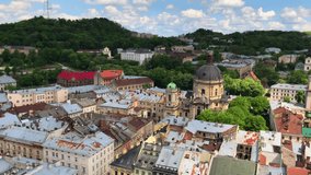 Old city center in Europe. Roofs. TV tower. Old lock. historical Buildings. Old city. Domes of the temple. Architecture. A cinematic overview of the city of Lviv from the air. Lviv Ukraine