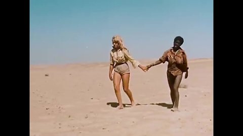 CIRCA 1957 - In this exploitation movie, slave traders in the desert keep women dehydrated and one of them has a mirage.