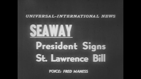 CIRCA 1954 - Michigan's Senator Ferguson and Canadian Ambassador Heeney are on hand as President Eisenhower signs the St. Lawrence Bill into law.