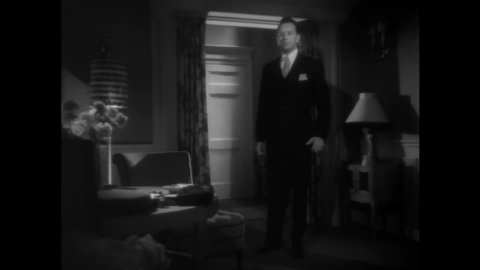 CIRCA 1948 - In this film noir, a criminal hits his girlfriend when she says she wants to leave him.